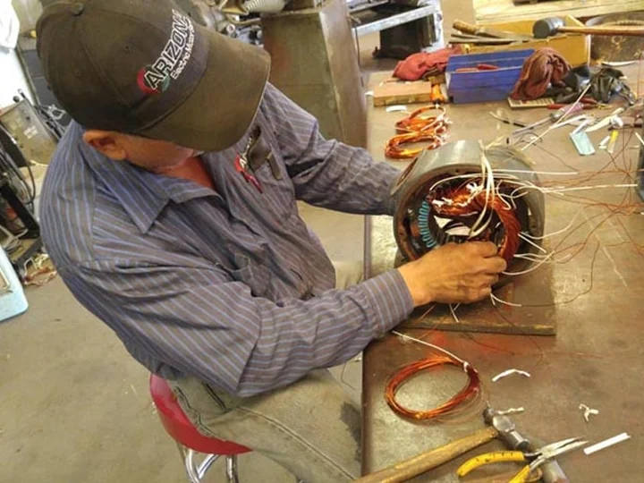 AEMS technician rewinding copper motor windings in the Tucson shop